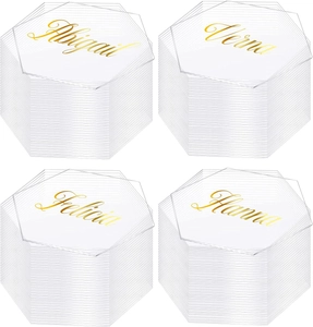 Detailed view of hexagonal clear acrylic table cards with custom gold calligraphy names