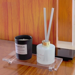 Acrylic tray with a 300ml amber diffuser and soy candle on a rustic wooden desk