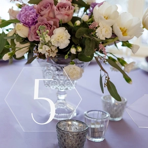 White hexagonal acrylic table number card with hollow design for wedding table setting