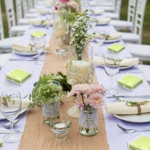 Detailed view of clear acrylic napkin holders on an outdoor dining table set