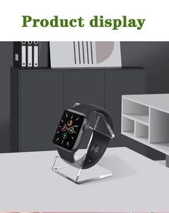 Detail view of transparent acrylic watch stand with stable L-shaped minimalist design