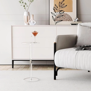 Detailed close-up of transparent acrylic side table with polished silver metal joint