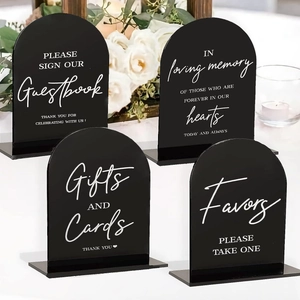 Set of four black arched acrylic wedding signs with white calligraphy and bases