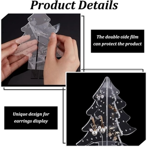 Macro detail of Christmas tree acrylic earring organizer with multiple jewelry display holes