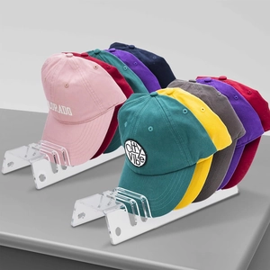 2-pack acrylic baseball cap display organizers showing multiple colorful hats on a stand