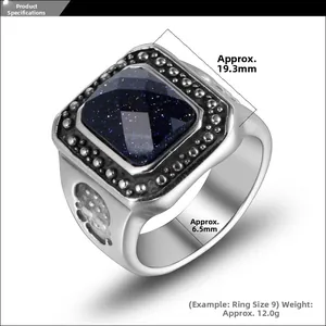 Macro detail of men's silver ring with square blue goldstone and side relief