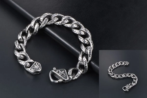 Macro shot of retro stainless steel cuban link bracelet with detailed scale textures