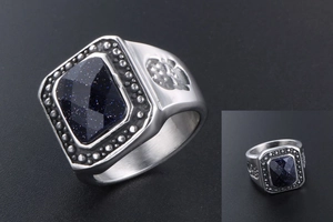 Detail of square-cut blue sandstone on silver-tone men's ring with embossed patterns
