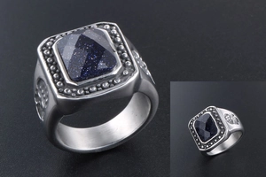 Close-up of vintage men's ring with rectangle blue sandstone and relief patterns
