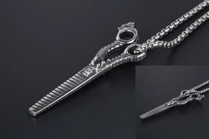 Macro shot of stainless steel dragon shears pendant with retro punk carving details