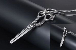 Macro detail of silver dragon pattern handle on barber comb pendant necklace
