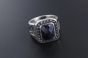 Macro shot of rectangular blue sandstone inlay on vintage stainless steel men's ring