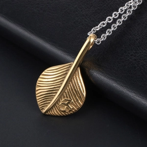 Retro stainless steel feather pendant necklace with gold leaf design on silver chain