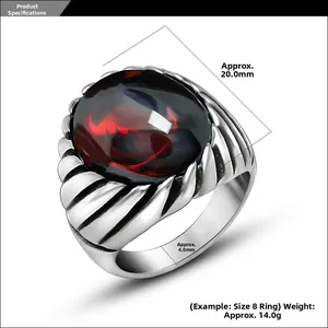 Detail view of retro steel ring with red agate stone and side spiral texture accents