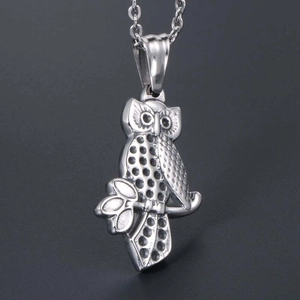 Vintage owl pendant necklace in polished stainless steel with intricate feather details