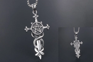 Detailed view of Gothic pendant featuring a cross with snake, dagger and pentagram