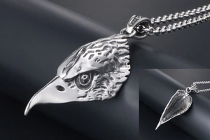 Macro detail of retro eagle head pendant showing sharp eyes and feather textures