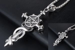 Detail of vintage steel pentagram cross pendant with fleur-de-lis on black leather