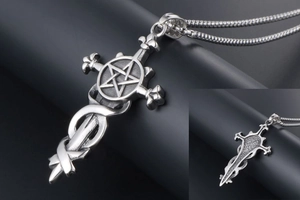 Macro detail of gothic silver steel sword pendant with star and cross on snake chain