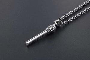 Detailed close-up of a silver stainless steel microphone pendant necklace for musicians