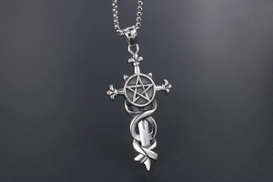 Macro view of gothic silver sword pendant with snake and pentagram on steel chain