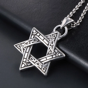 Vintage steel hexagram pendant necklace with ornate floral engravings on black leather