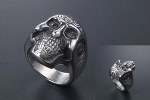 Gothic skull ring close-up showing vintage punk style and intricate silver steel texture