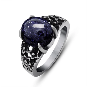 Vintage stainless steel ring with oval blue sandstone and etched floral patterns