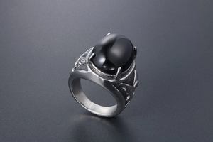 Detailed view of silver eagle ring featuring a large black oval agate inlay and vintage relief