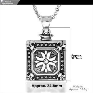 Detailed view of a vintage square titanium steel pendant with floral relief and dimensions