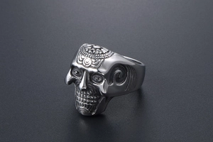 Close-up of gothic skull ring with intricate mandala engraving on vintage stainless steel
