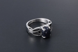 Detailed view of vintage stainless steel ring with oval blue aventurine gemstone