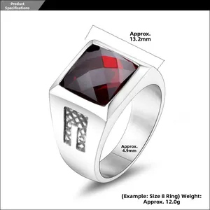Detail of vintage square red gemstone ring with hollow grid pattern on silver steel band