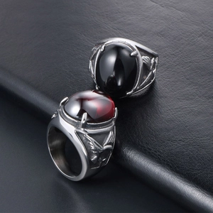 Eagle wing titanium steel ring set with oval black agate and deep red gemstone