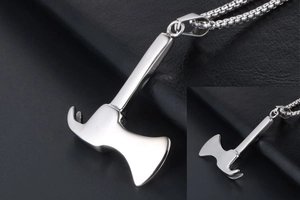 Macro view of polished silver axe and hammer pendant with box chain craftsmanship