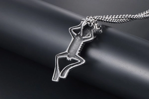 Close-up of gothic skeleton skull pendant on a premium woven titanium steel chain