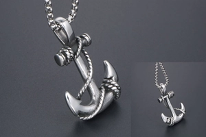 Close-up of vintage stainless steel anchor pendant with intricate spiral rope texture details