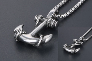 Close-up of anchor pendant necklace with rope detail and square box chain for men