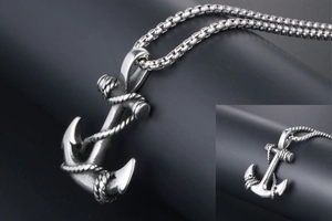 Close-up of vintage steel anchor pendant with rope detail and durable chain link