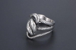 Detail of vintage snake ring showing intricate scale texture and twin head design