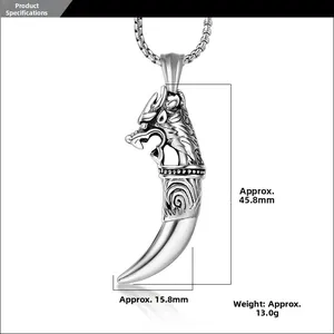 Detailed view of silver dragon head pendant with size measurements and ornate carvings