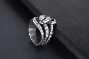 Macro detail of vintage punk style double snake ring with detailed scale texture