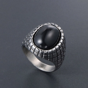 Retro men's signet ring featuring black oval onyx stone and textured steel band