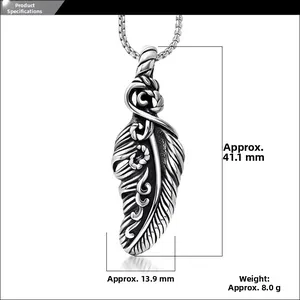 Detailed view of vintage feather pendant dimensions 41.1mm x 13.9mm in oxidized steel