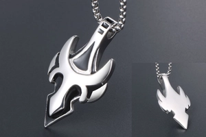 Close-up of titanium steel wolf tooth pendant with black enamel inlay and bead chain