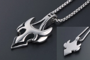 Detailed macro view of silver titanium steel wolf tooth pendant with box chain
