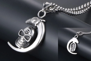 Detailed view of silver moon skull pendant with gothic punk chain and textured finish