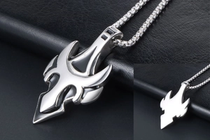 Polished stainless steel tribal wolf tooth pendant showing front and back views on black leather