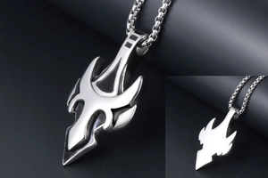 Close-up of gothic stainless steel winged arrow pendant with chunky metal curb chain