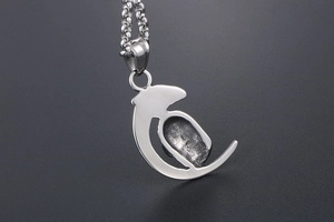 Detailed view of stainless steel moon pendant with vintage texture and O-chain link